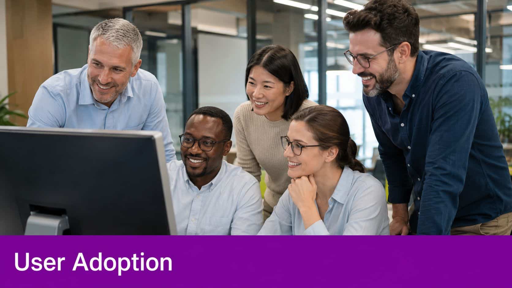 A diverse group of professional colleagues collaborating and reviewing content on a computer screen in an office.